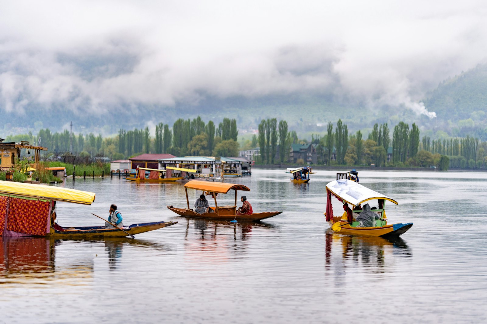 Boats on Dal Lake at dawn